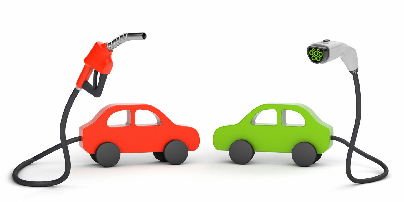 Fuel pump and plug for charging electric vehicles isolated on white background