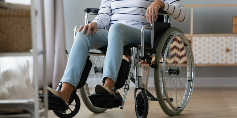 Unable,To,Walk,Aged,Handicapped,Woman,Sitting,In,Wheel,Chair