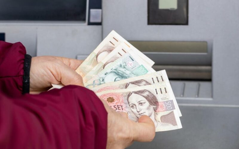 Woman,Counts,Money,Withdrawn,From,An,Atm,,Czech,Koruna,,Financial